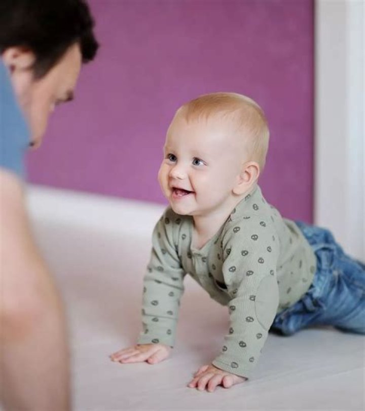 Why do babies start crawling backwards?